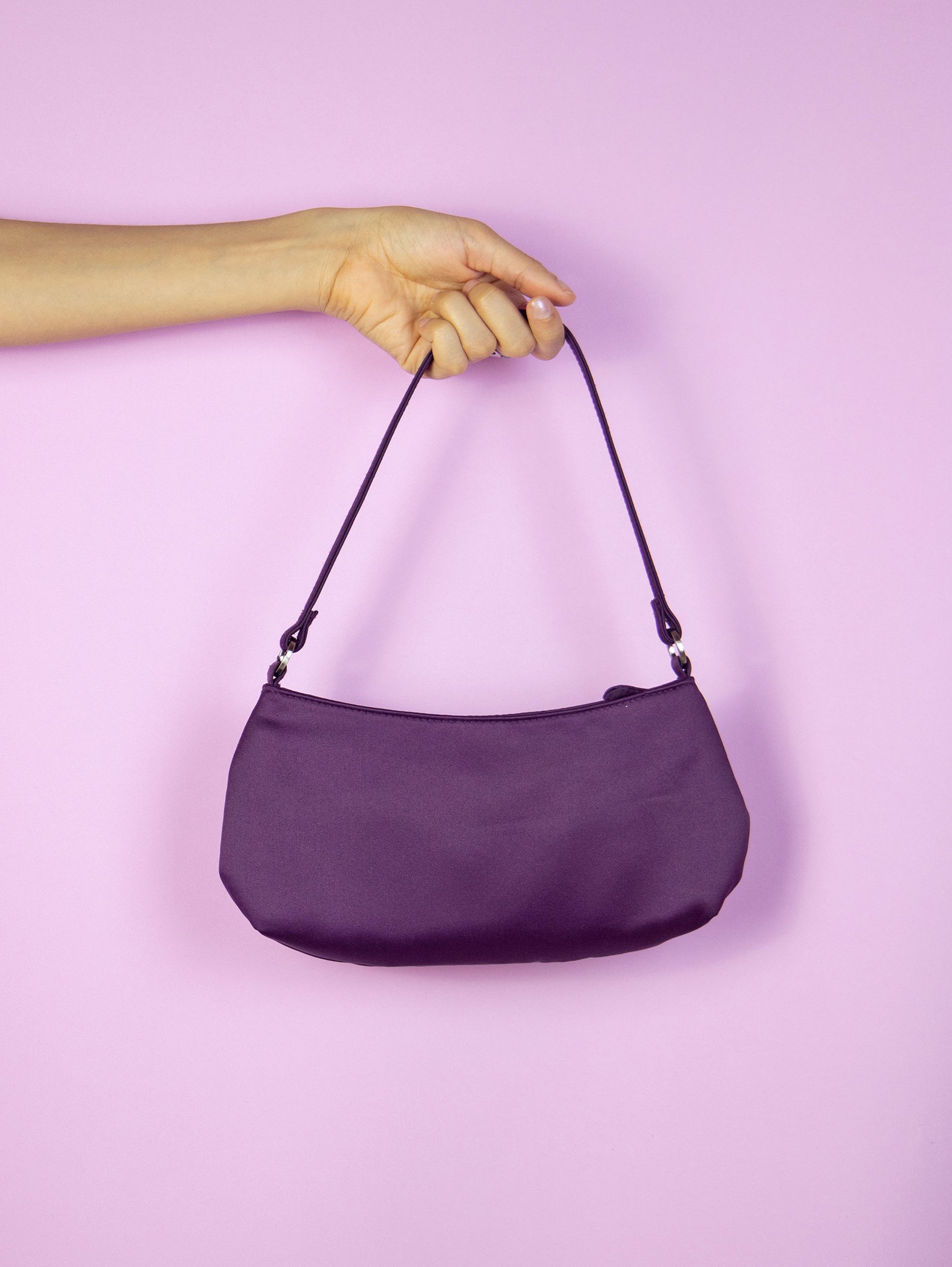 The Y2K Purple Baguette Mini Bag is a vintage dark purple shoulder bag with a zip closure. Cyber 2000s party night top handle purse.
