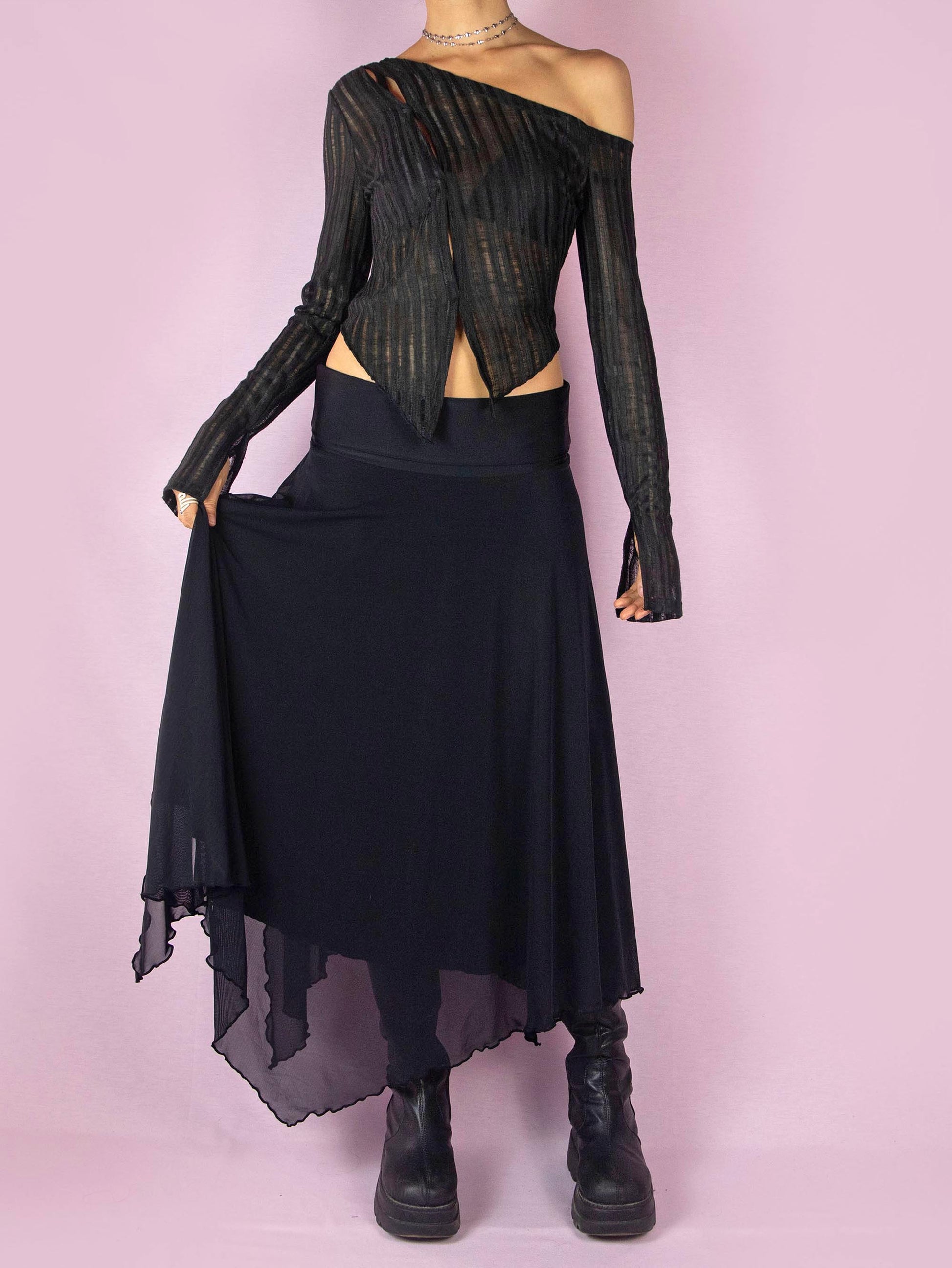 The Y2K Black Mesh Maxi Skirt is a vintage 2000s deconstructed subversive night-out party midi skirt with an elastic waist and an asymmetrical handkerchief hem.