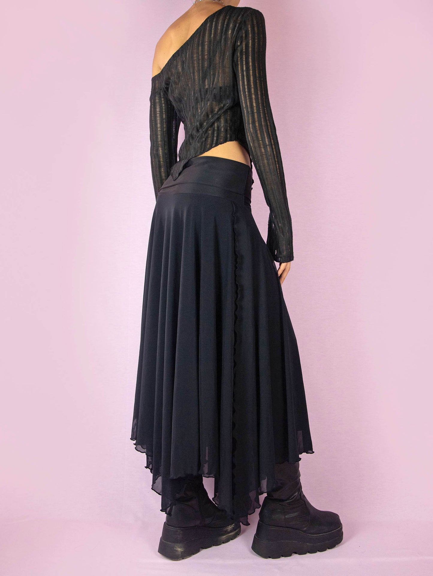 The Y2K Black Mesh Maxi Skirt is a vintage 2000s deconstructed subversive night-out party midi skirt with an elastic waist and an asymmetrical handkerchief hem.