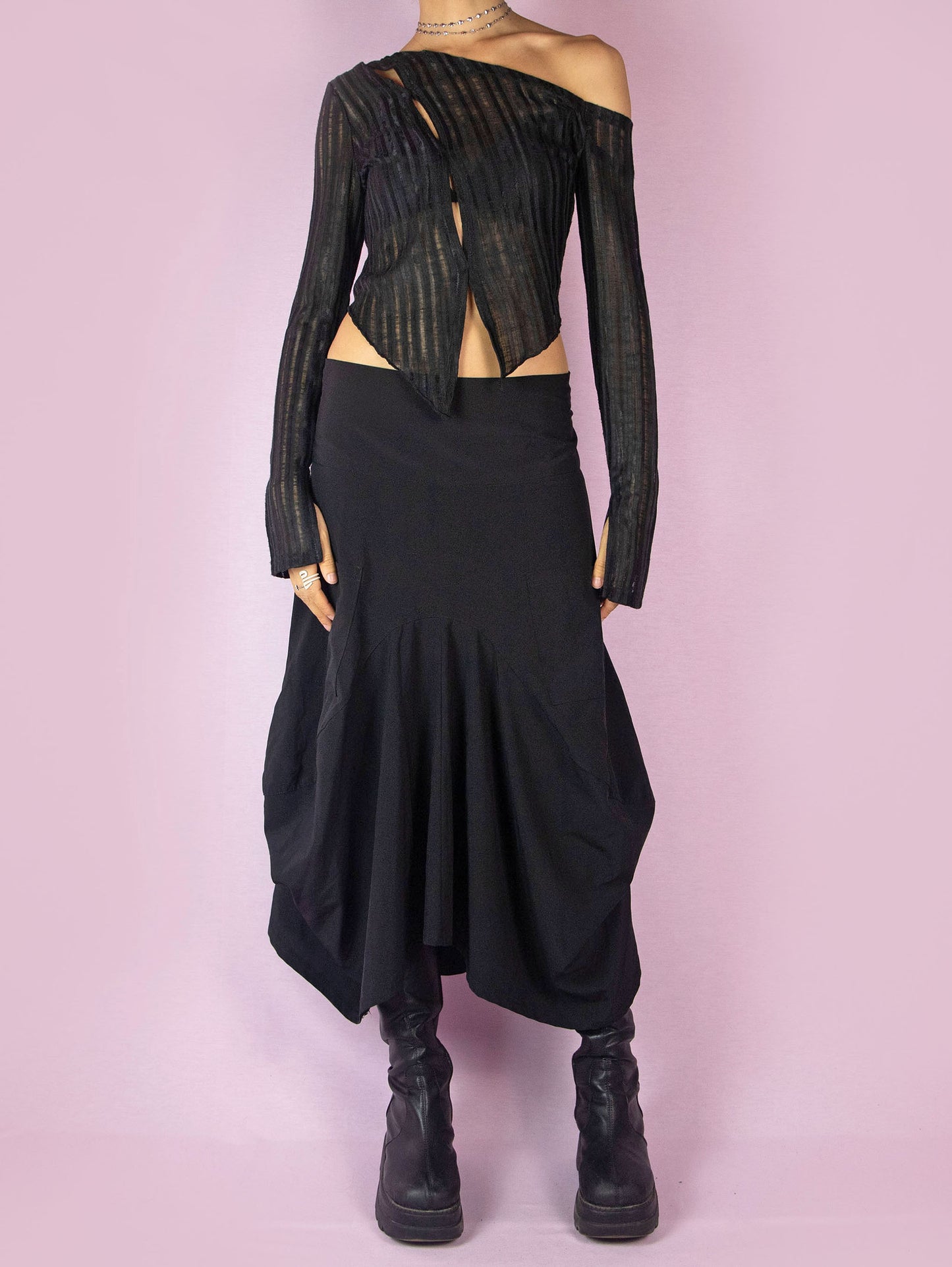 The Y2K Black Balloon Midi Skirt is a vintage 2000s avant-garde deconstructed subversive bubble-style skirt, slightly stretchy, with pockets, pleats, an asymmetrical hem, and a back zipper closure. Made in France.