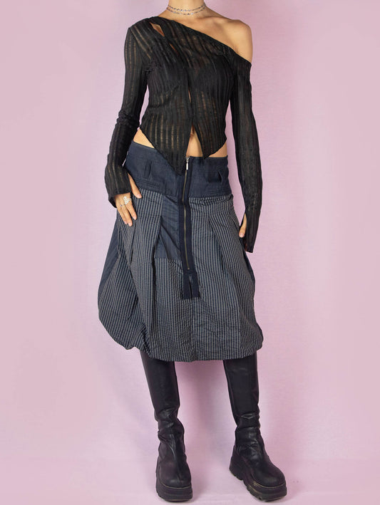 The Y2K Blue Balloon Midi Skirt is a dark navy blue vintage 2000s avant-garde subversive bubble style skirt with a pinstripe pattern and front zipper closure.