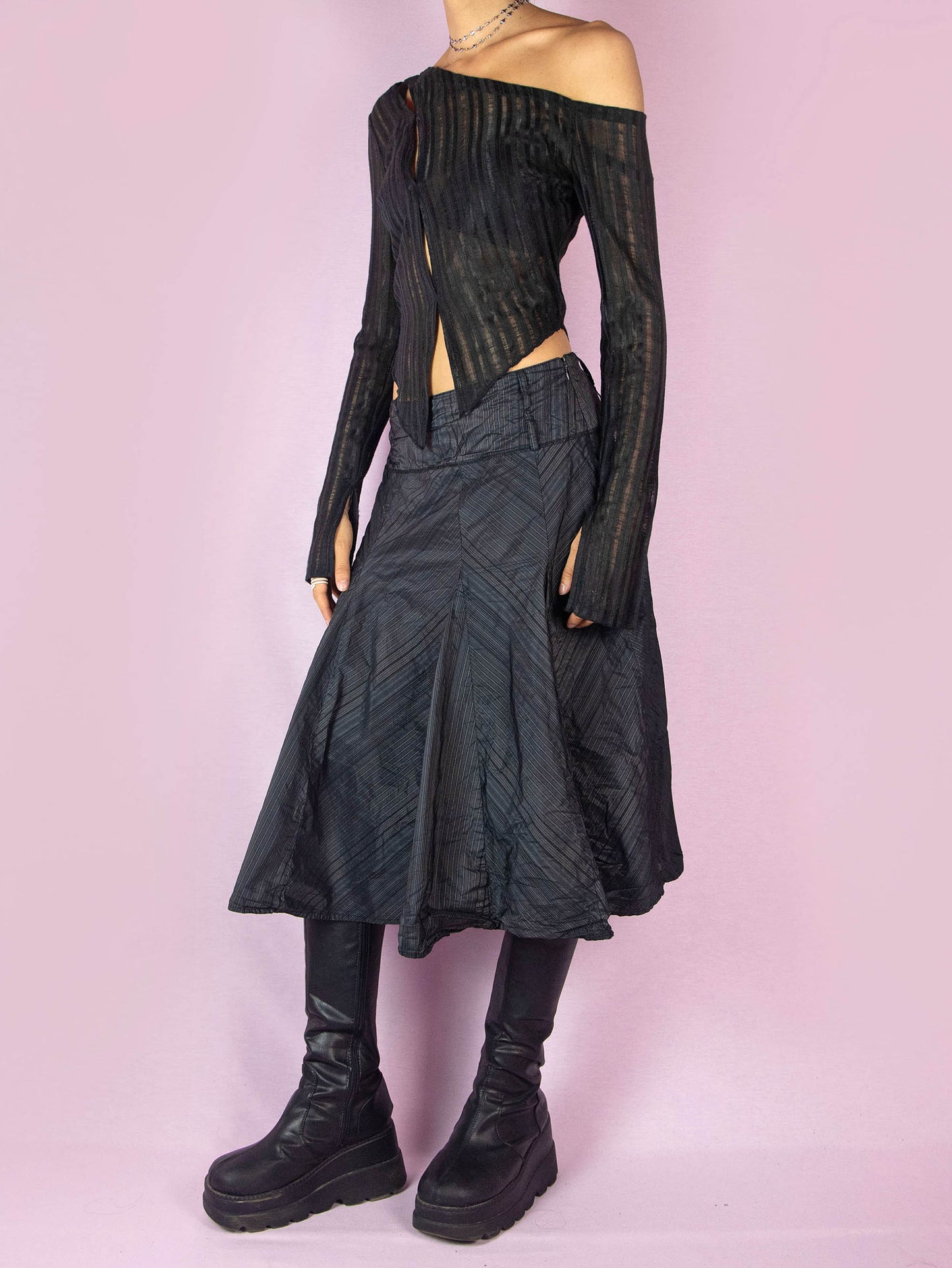 The Y2K Black Godet Circle Skirt is an elegant vintage 2000s midi skirt with a pinstripe pattern and side zipper closure.