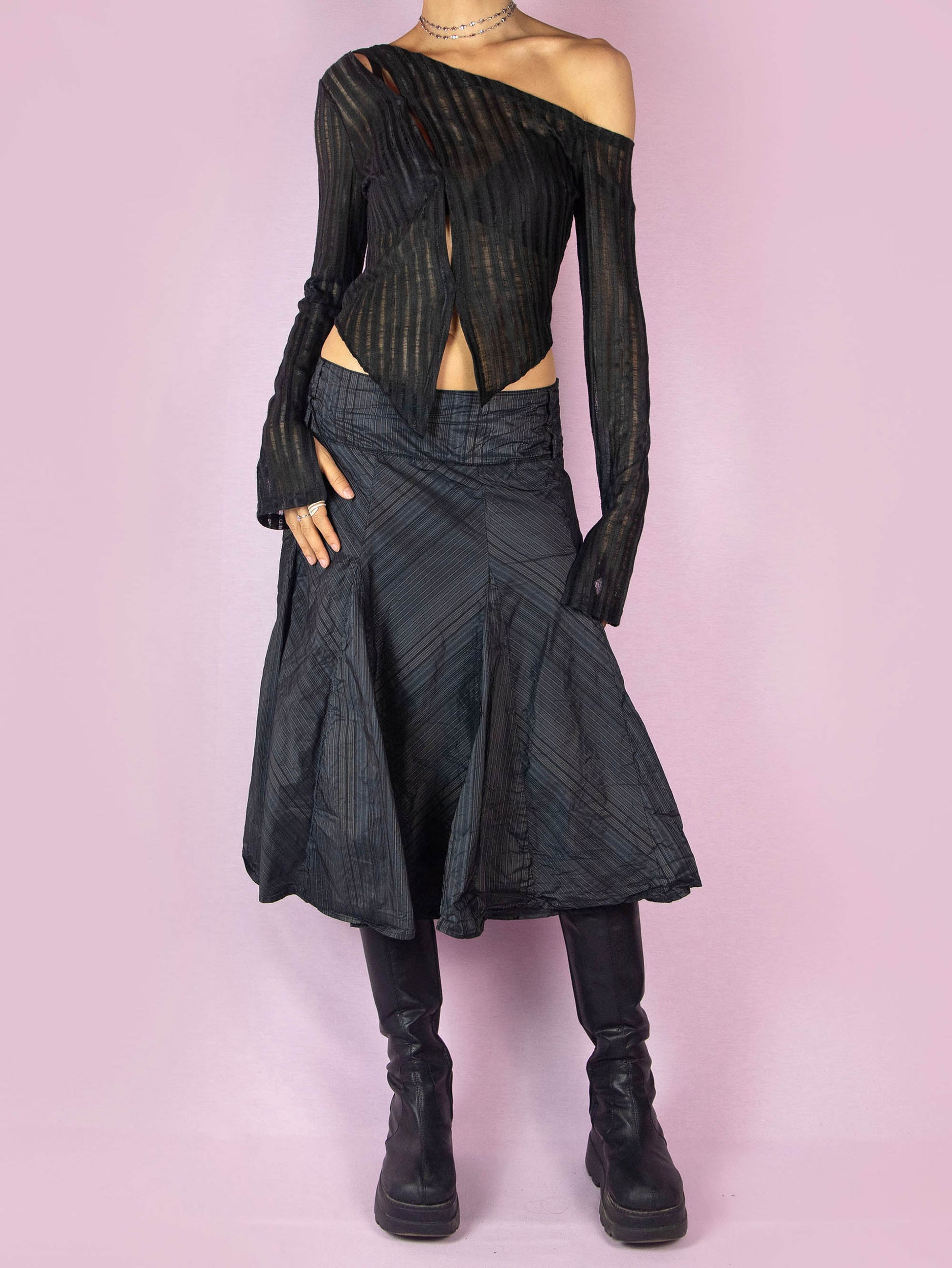 The Y2K Black Godet Circle Skirt is an elegant vintage 2000s midi skirt with a pinstripe pattern and side zipper closure.