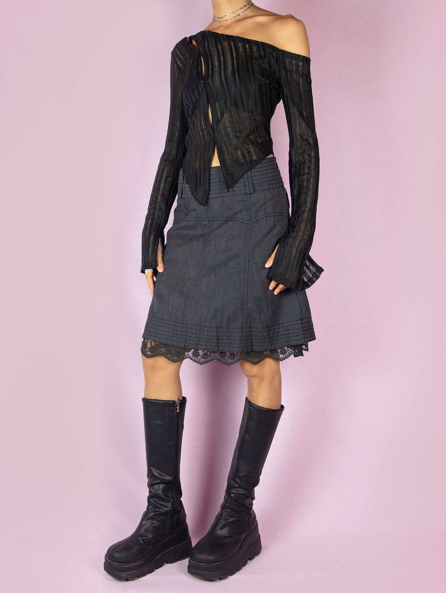 The Y2K Gray A Line Mini Skirt is a vintage 2000s casual dark gray skirt with a side zipper closure and lace detail at the hem.