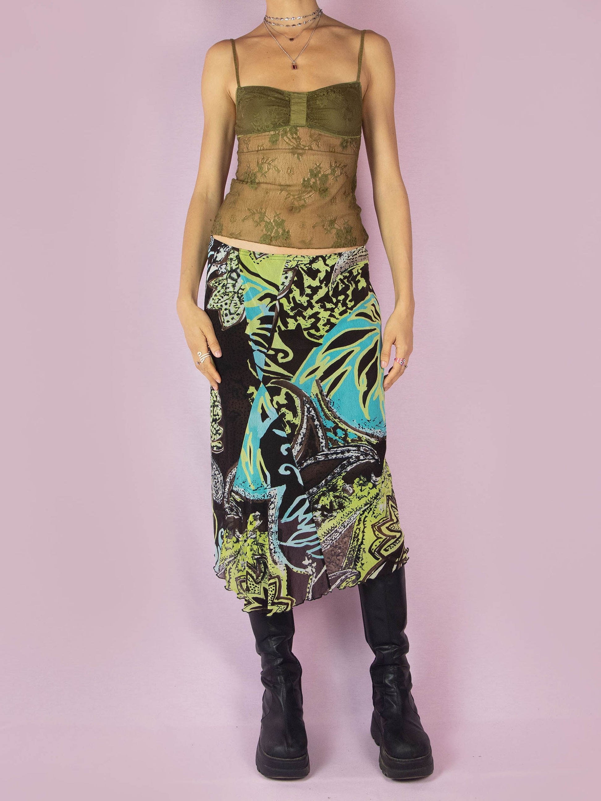 The Y2K Printed Mesh Midi Skirt is an asymmetric vintage 2000s boho summer skirt with an abstract tropical floral graphic and an elastic waist.