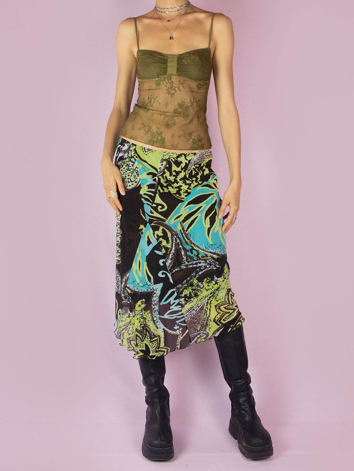 The Y2K Printed Mesh Midi Skirt is an asymmetric vintage 2000s boho summer skirt with an abstract tropical floral graphic and an elastic waist.