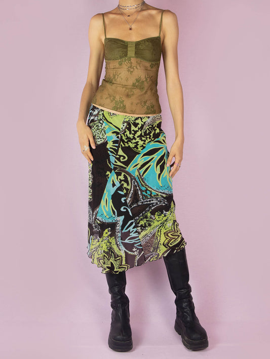 The Y2K Printed Mesh Midi Skirt is an asymmetric vintage 2000s boho summer skirt with an abstract tropical floral graphic and an elastic waist.