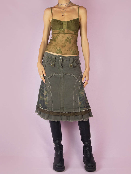The Y2K Khaki Denim Midi Skirt is a green vintage 2000s avant-garde subversive deconstructed skirt with stud details, lace, camouflage print, ruffle hem, and frayed seams.