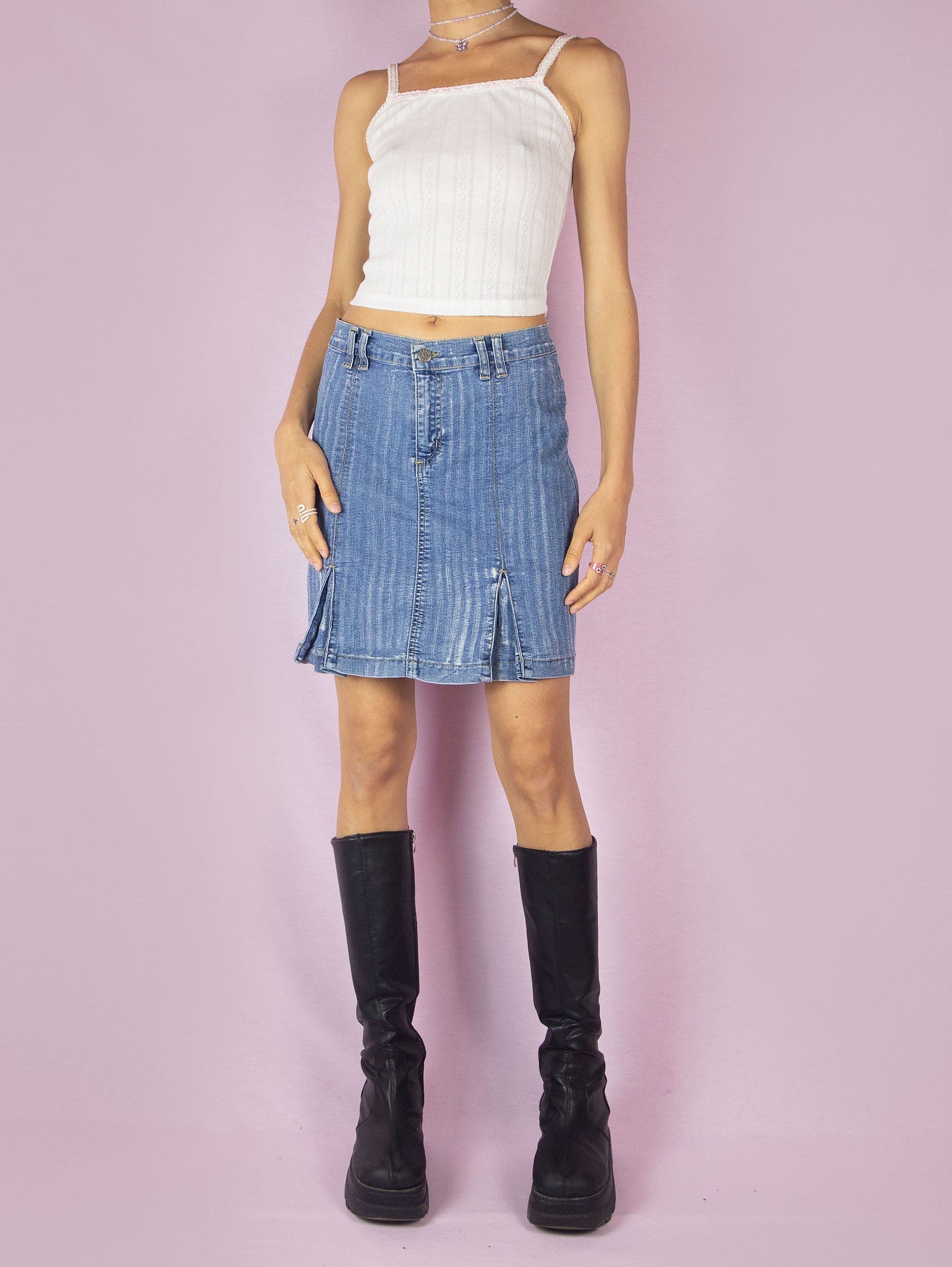 The Y2K Denim Pleated Mini Skirt is a vintage 2000s stretchy A-line jean skirt with an acid wash striped effect.