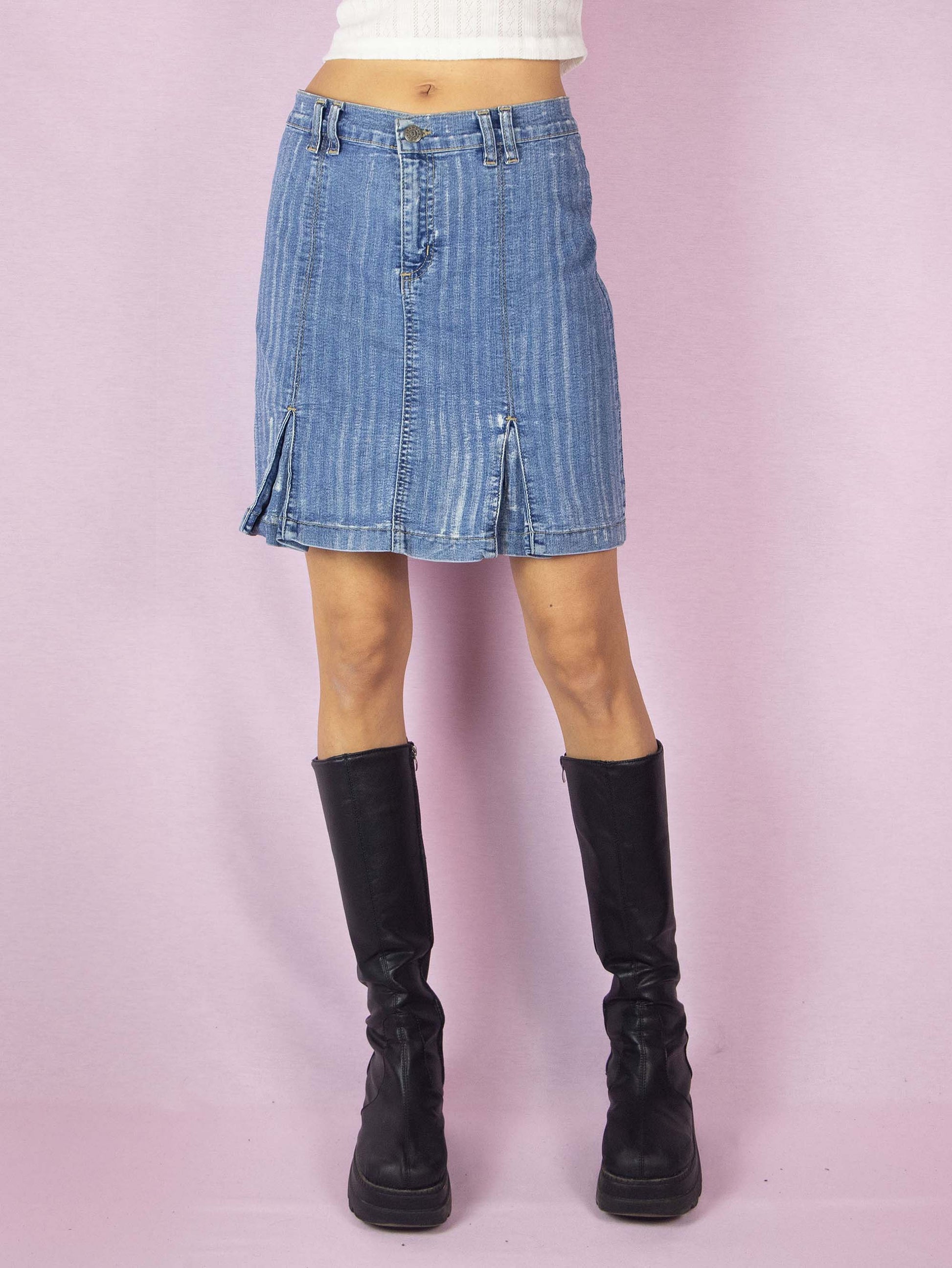 The Y2K Denim Pleated Mini Skirt is a vintage 2000s stretchy A-line jean skirt with an acid wash striped effect.