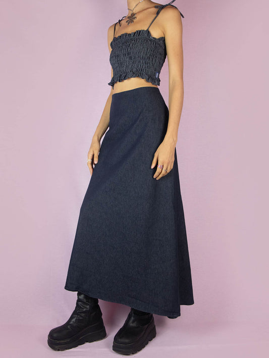 The Y2K Denim Asymmetric Maxi Skirt is a stretchy dark jean vintage 2000s subversive deconstructed A-line midi skirt with a back zipper closure.