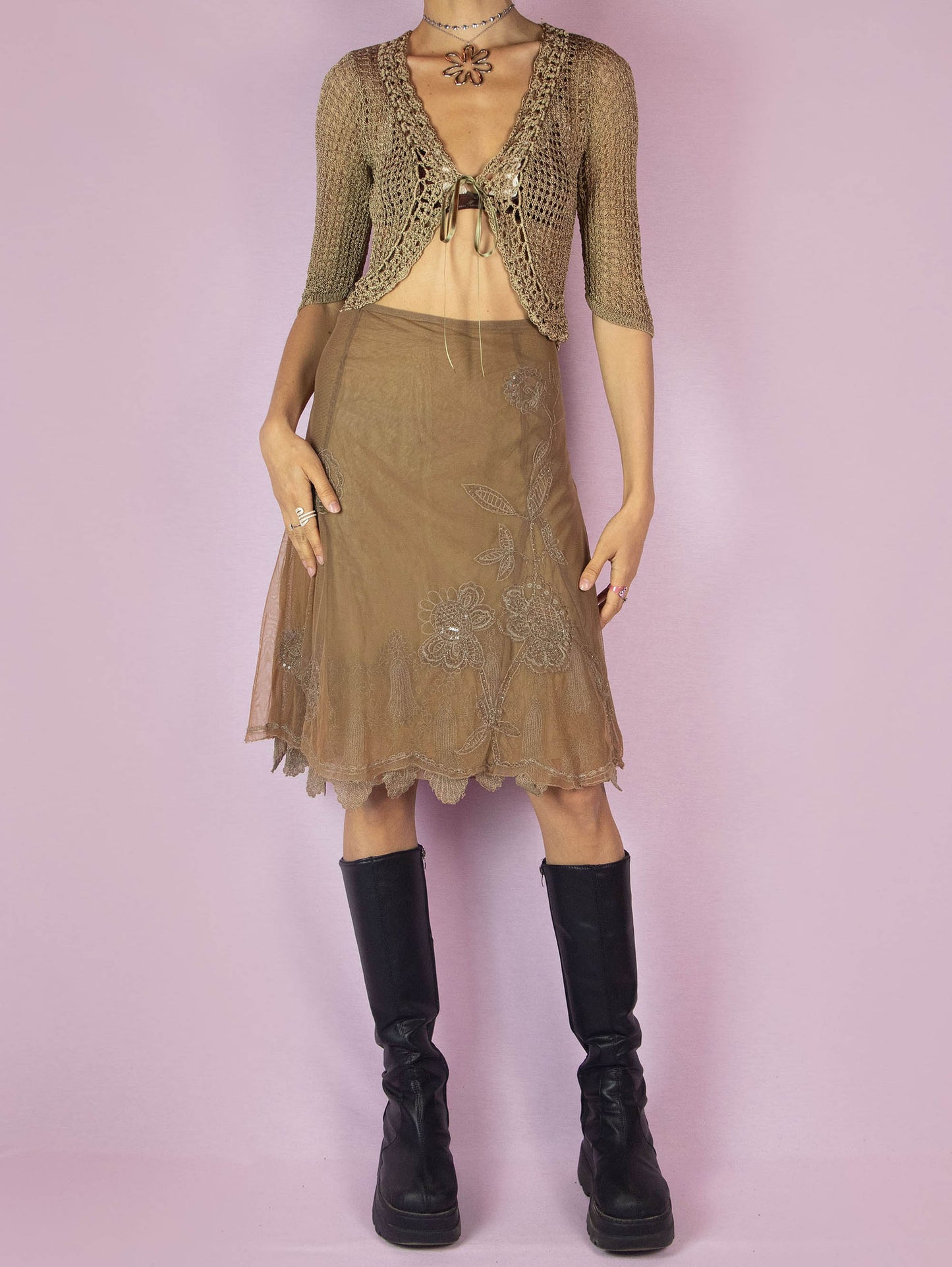 The Y2K Brown Mesh Tulle Skirt is a vintage 2000s elegant and romantic evening party style trumpet midi godet skirt embellished with sequins and beads, featuring a side zipper closure and with floral embroidered details.