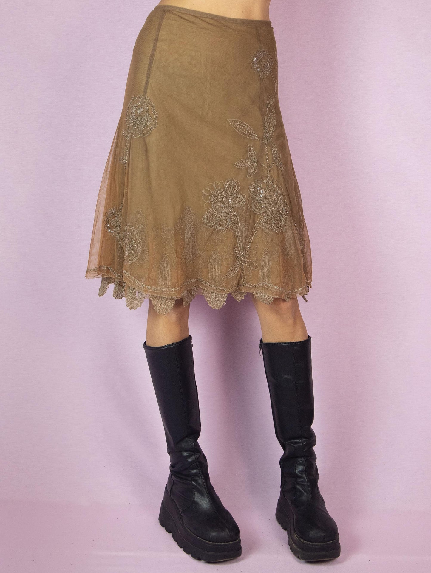 The Y2K Brown Mesh Tulle Skirt is a vintage 2000s elegant and romantic evening party style trumpet midi godet skirt embellished with sequins and beads, featuring a side zipper closure and with floral embroidered details.