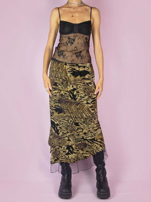 The Vintage 90s Asymmetric Trumpet Midi Skirt is an elastic party night skirt with a textured multicolor abstract print, an elastic waistband, and a black tulle ruffle hem.
