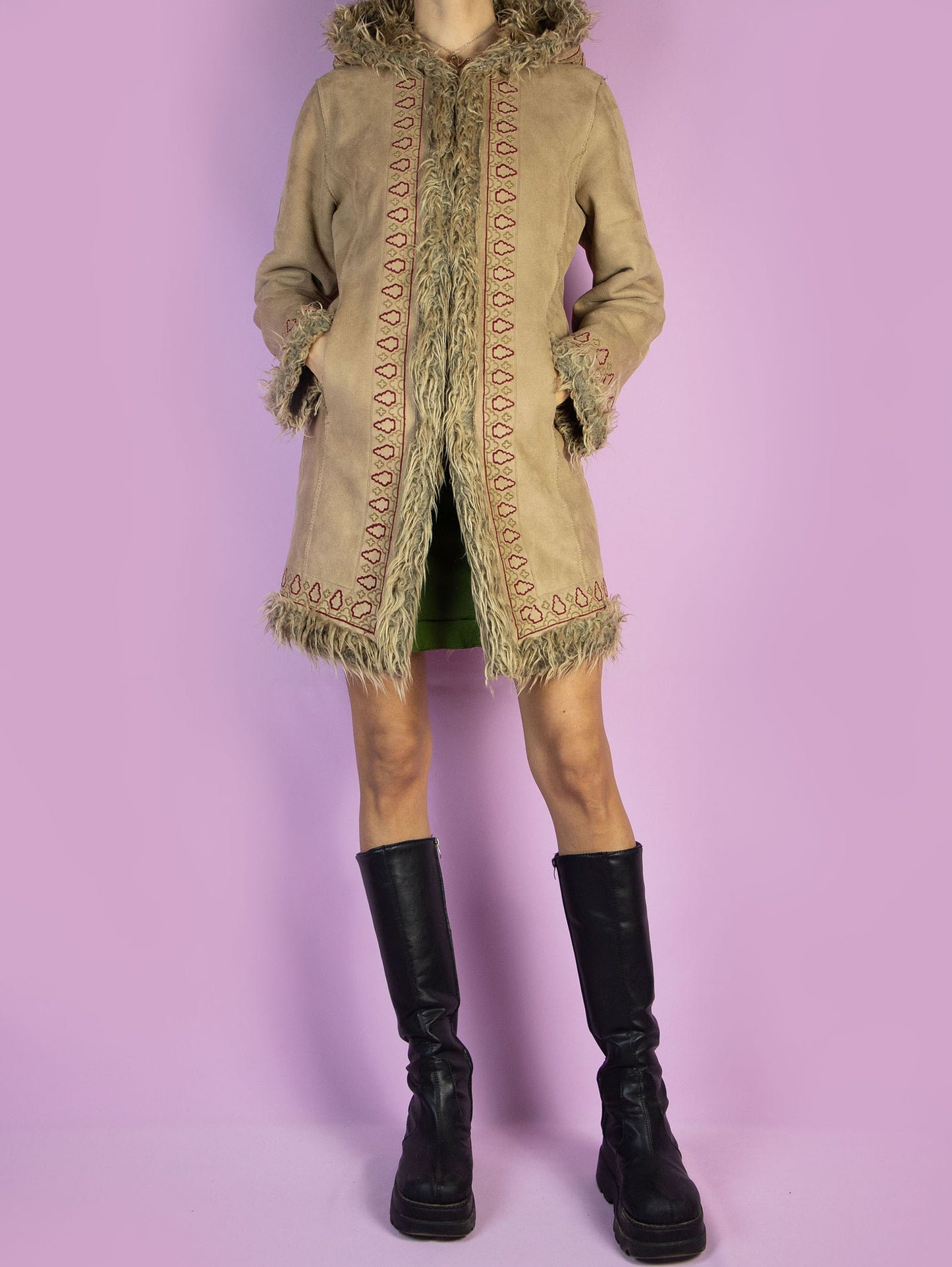 The Y2K Beige Hooded Afghan Coat is a vintage light brown beige faux suede coat with faux fur interior, collar, and cuffs. It also features a hood, pockets, and hook closure. Boho fairy grunge whimsygoth 2000s penny lane winter statement jacket.