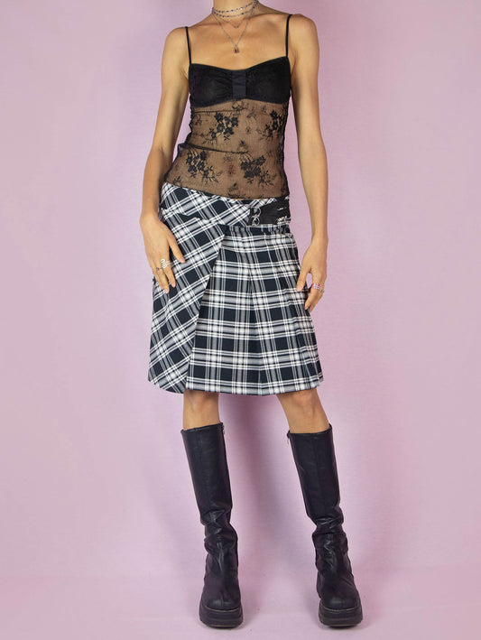 The Y2K Plaid Check Wrap Skirt is a vintage 2000s preppy school-style black and white pleated knit midi skirt.