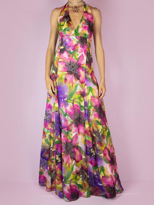 The Y2K Floral Halter Maxi Dress is a vintage 2000s formal party full circle dress with a deep v-neckline that ties at the neck and has a back zipper closure.