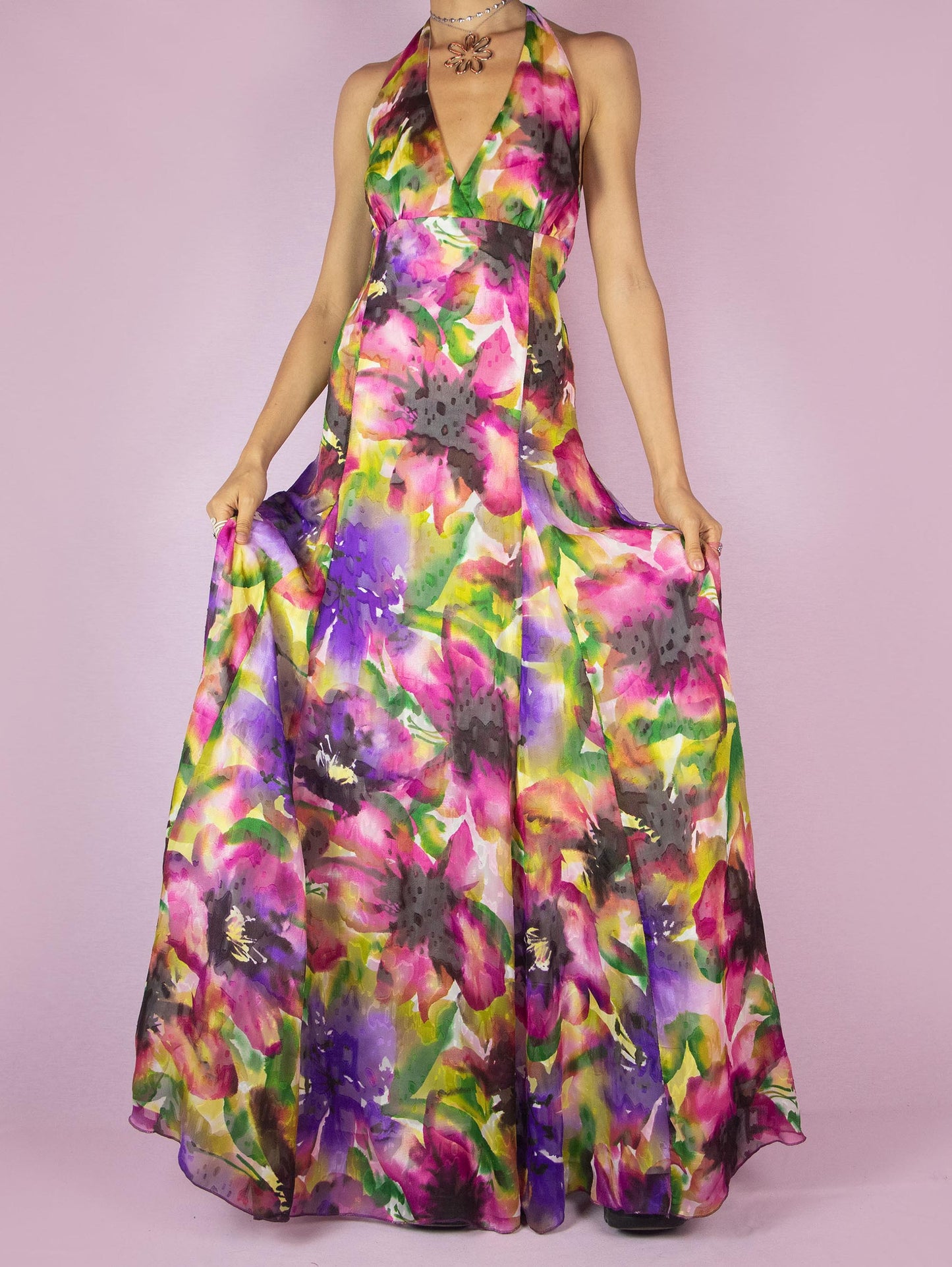 The Y2K Floral Halter Maxi Dress is a vintage 2000s formal party full circle dress with a deep v-neckline that ties at the neck and has a back zipper closure.