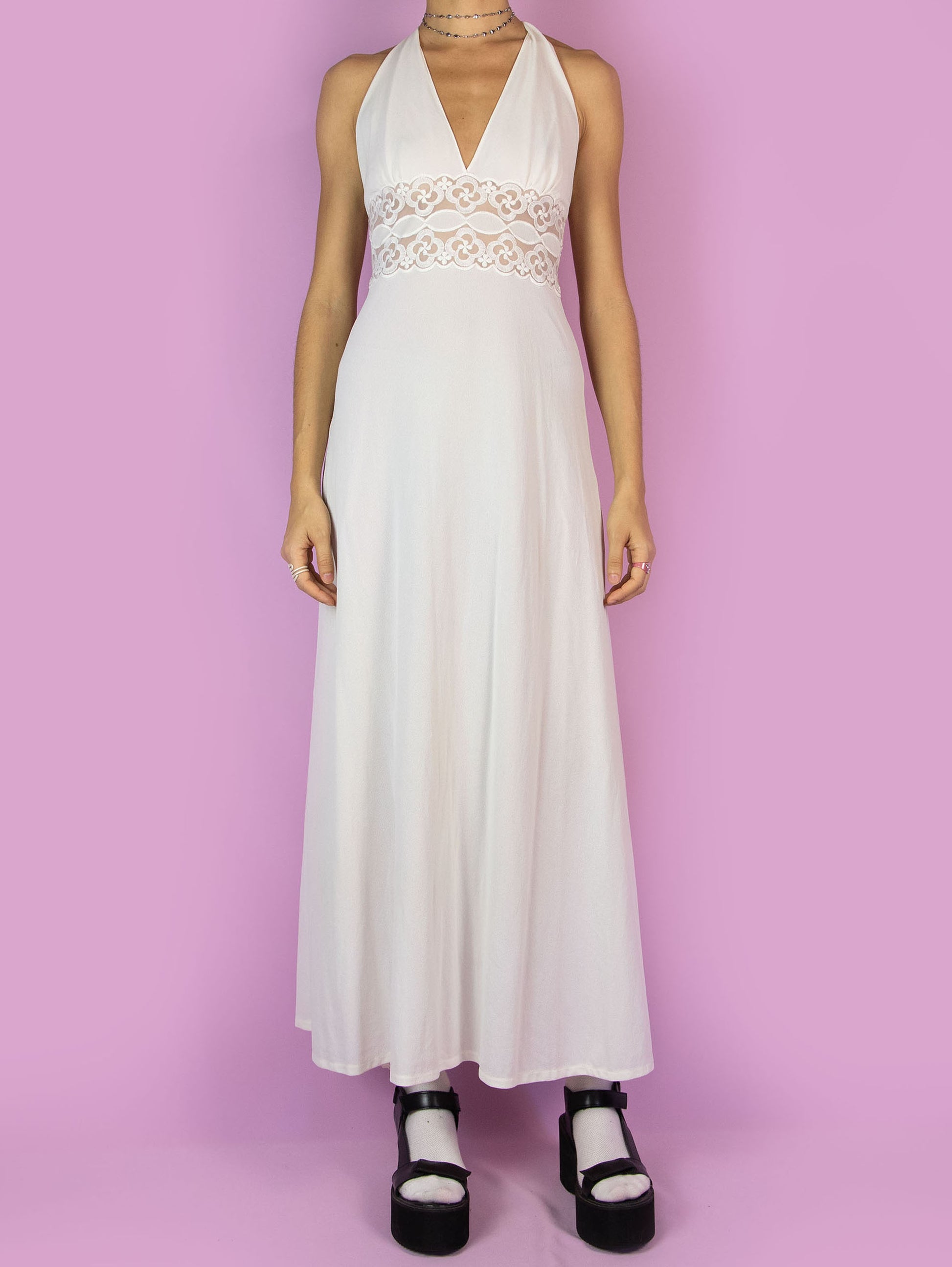 The Vintage 70s White Halter Maxi Dress is an off-white open-back midi dress with lace details at the waist. Romantic lingerie 1970s boho slip night dress.