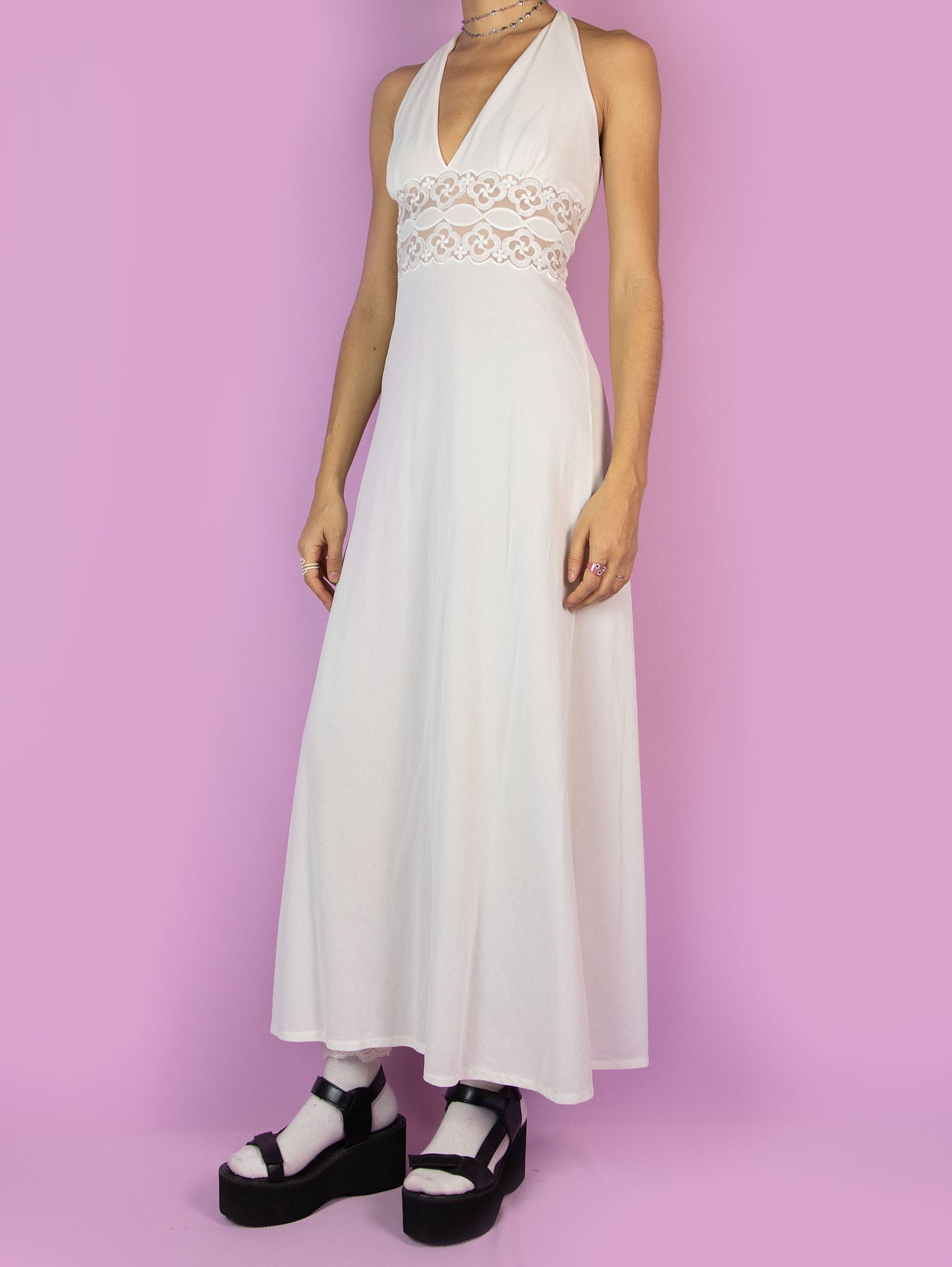 The Vintage 70s White Halter Maxi Dress is an off-white open-back midi dress with lace details at the waist. Romantic lingerie 1970s boho slip night dress.