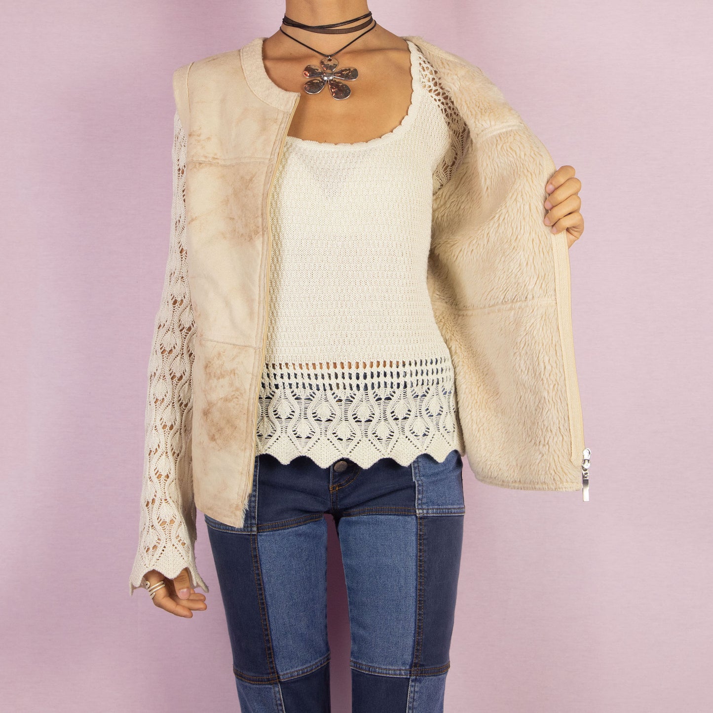 The Y2K Beige Wool Blend Vest is a vintage 2000s casual piece featuring a zip-up front and a soft, virgin wool blend faux suede finish. Perfect for comfy, cozy fall and winter outfits.