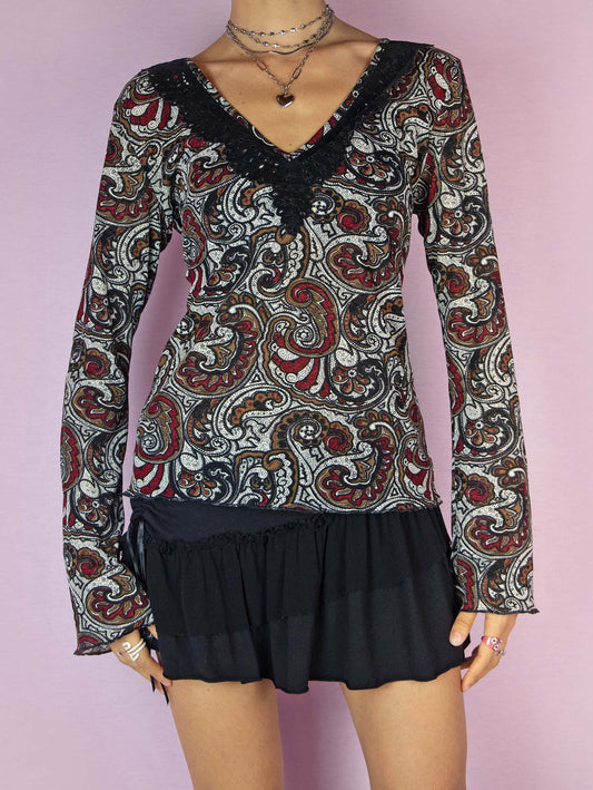 The Y2K Bell Sleeve Print Mesh Top is a vintage 2000s boho semi-sheer long sleeve shirt with a paisley floral graphic and a V-neck.