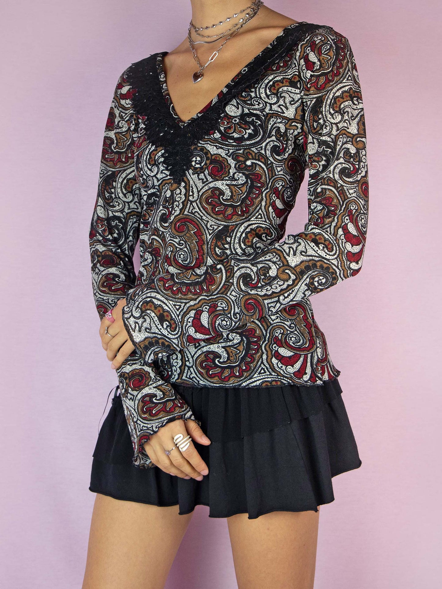 The Y2K Bell Sleeve Print Mesh Top is a vintage 2000s boho semi-sheer long sleeve shirt with a paisley floral graphic and a V-neck.