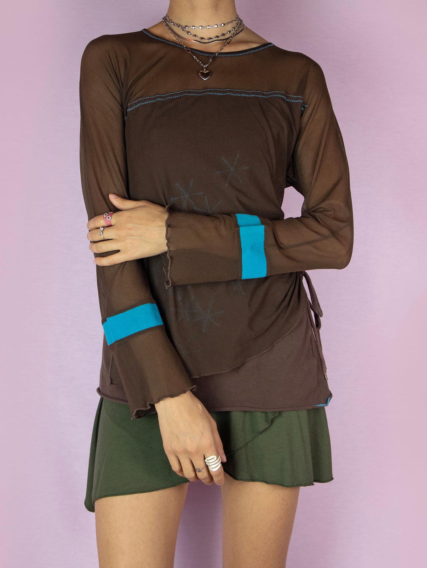 The Y2K Brown Mesh Asymmetric Top is a vintage 2000s subversive deconstructed long-sleeve semi-sheer layered shirt with a ruched side drawstring tie.