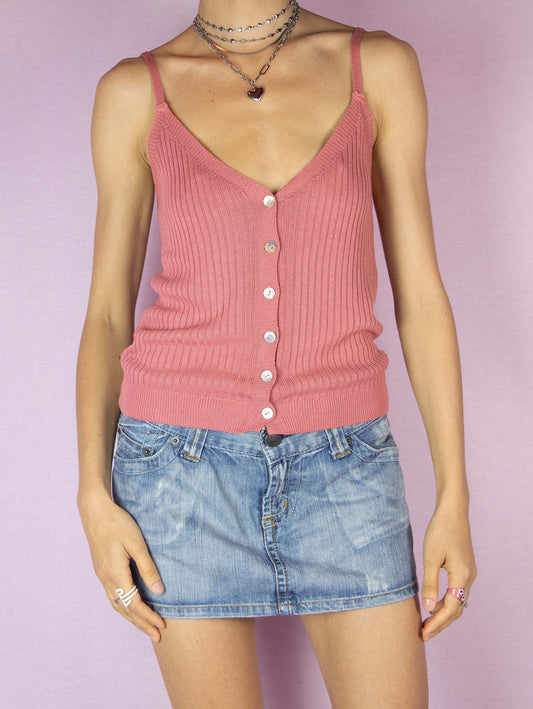 The Y2K Rib Knit Tank Top is a vintage 2000s boho summer style ribbed knit camisole in a soft pink-coral-terracotta color. It features spaghetti straps, a deep V-neckline and the front is buttoned down.